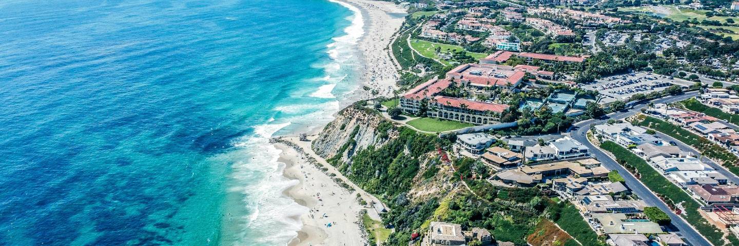 The Orange County coastline from above: the communities this firm represents
