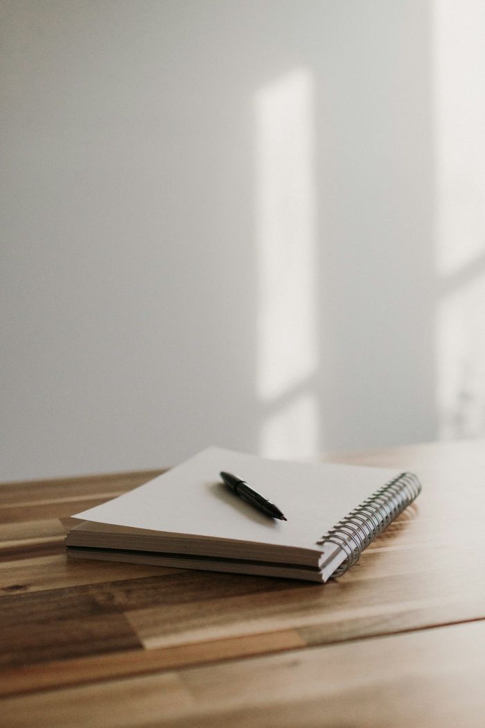 A closed notebook and pen: write down what you remember while it is sharp